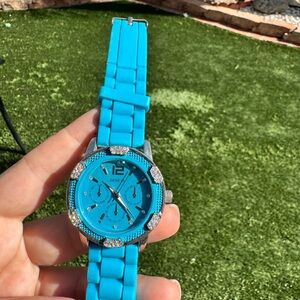 Geneva ladies baby blue rubber band watch jeweled bezel